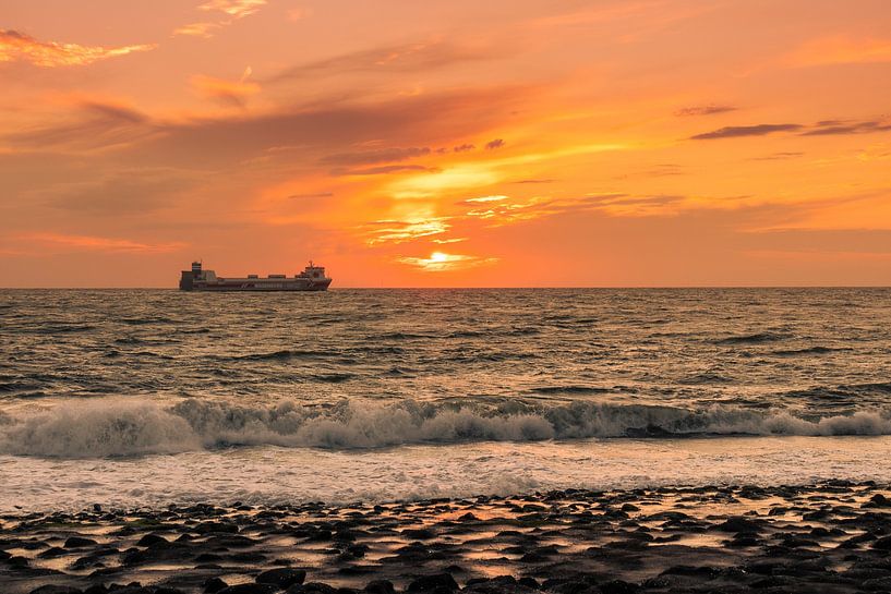 Sunset Westkapelle with a boat on the horizon by Rick van de Kraats