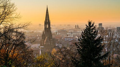 Freiburg im Breisgau orange sunset sky above skyline by adventure-photos