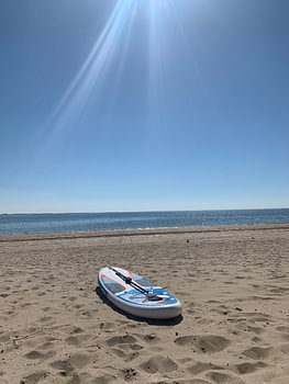 Paddleboard on the beach.