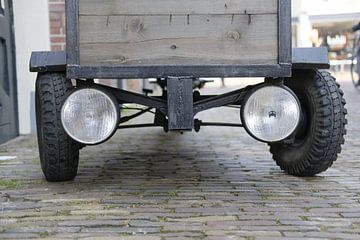 Cart with large headlights and wheels by Ronald Smits