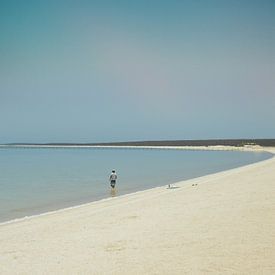 Lonely man on Shell Beach van Iris Berents