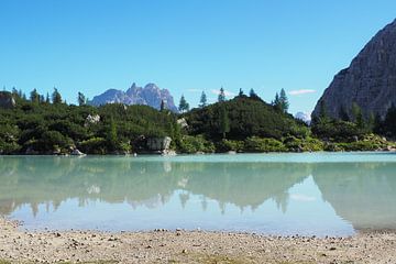 The turquoise-coloured Lake Sorapis is nestled in the dramatic rocky backdrop of the Dolomites and looks like a magical place from another world - wild, clear and breathtakingly beautiful. by Miriam Schwarzfischer Fotografie