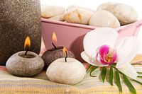 wellness in gray and pink with orchid and burning candles
