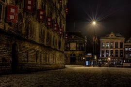 The weigh house and the Gouda town hall in the snow by Eus Driessen