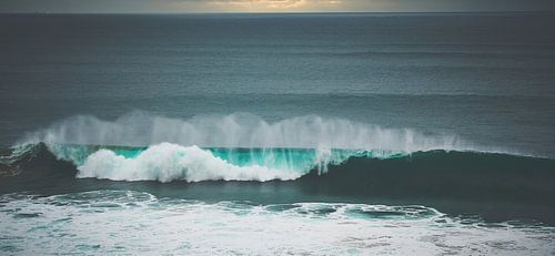 Azure wave in the light of the setting sun by Marloes van Pareren