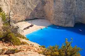 Shipwreck on the beach by Dennis van de Water