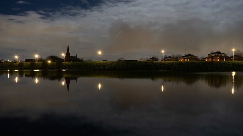 Heteren church on the dike with a full moon by Mike Nuijs