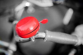 Red bicycle bell by Stewart Leiwakabessy
