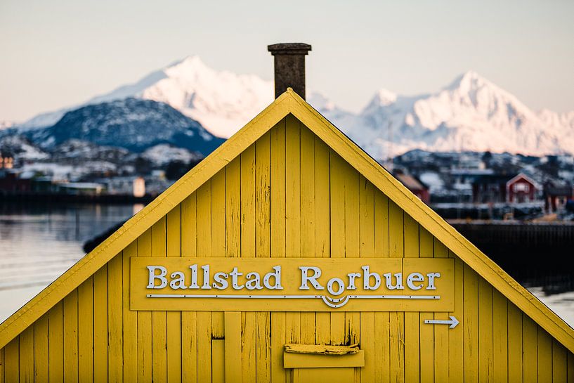 Roof of a yellow wooden house in the Lofoten Islands by Martijn Smeets