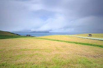 Clouds over Koltur island from Sydradalur on the Faroe Islands