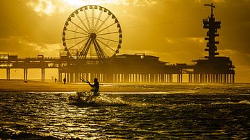 Kitesurfer in action at Scheveningen Pier. by Jaap van den Berg