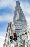 Traffic lights in front of the Shanghai Tower skyscraper in the modern part of Shanghai