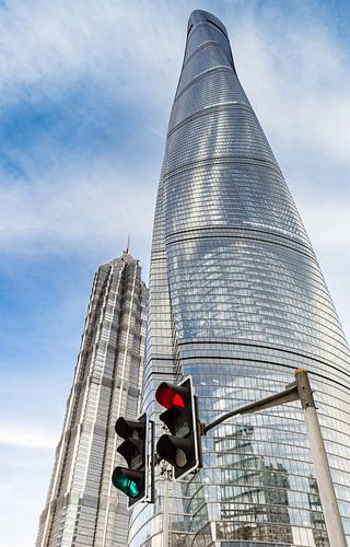 Traffic lights in front of the Shanghai Tower skyscraper in the modern part of Shanghai
