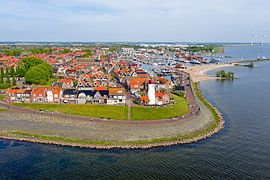 Aerial view of the town of Urk with the lighthouse by Eye on You