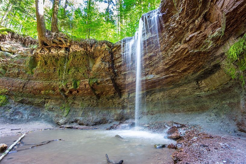 Germany, Hoerschbach waterfall in green forest by adventure-photos