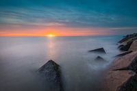 Havenhoofd Scheveningen en ondergaande zon
