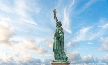 Statue of liberty in New York City, USA with blue sky background by Maria Kray