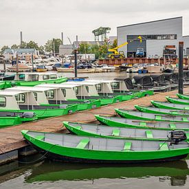 Rental boats in the Old Marina of the Dutch village of Drimmelen by Ruud Morijn