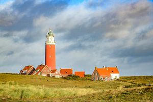 Texel lighthouse in the dunes during a stormy autumn morning