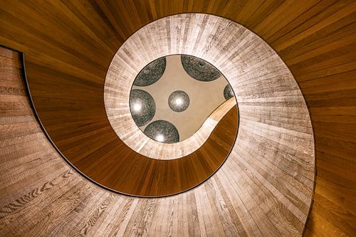 Looking up at a spiral staircase