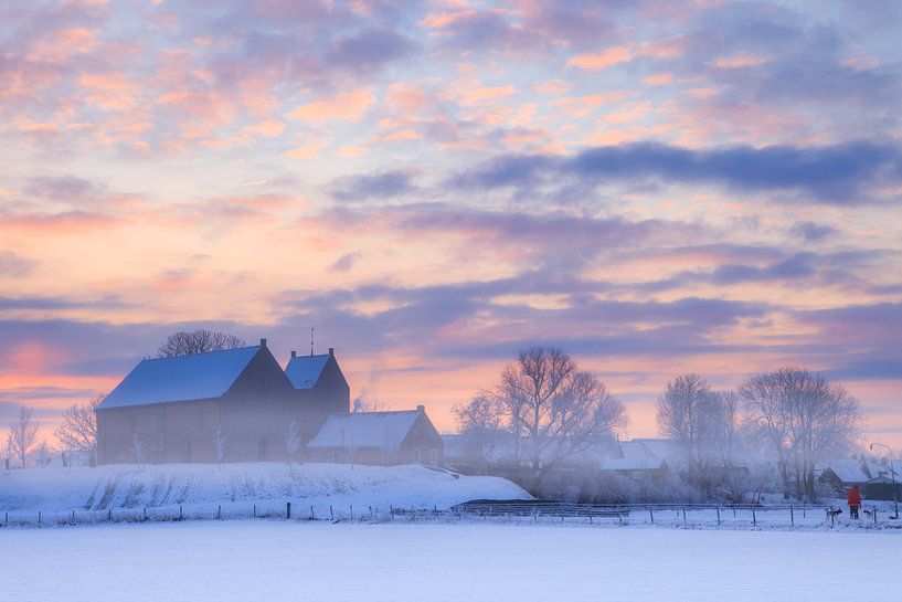 The famous church of Ezinge in a white winter landscape with a beautiful sunrise in Groningen. by Bas Meelker