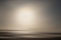 Abstract Sunset/sunrise on the coast in sepiatone.