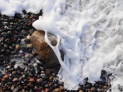 Rock in the surf, photographed from above