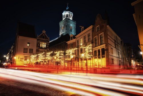 Traffic in front of the Lebuïnus Church with Christmas lights in Deventer