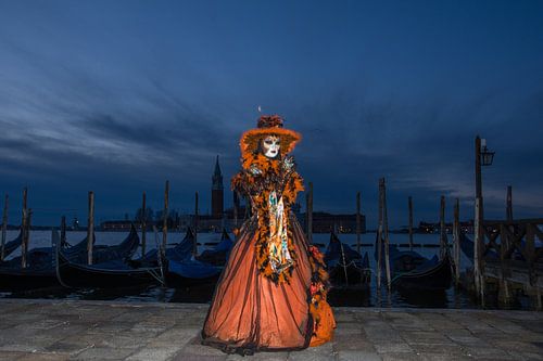 Model during blue hour in Venice during the carnival.