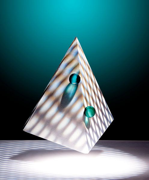 Floating pyramid, two green marbles on a darkgreen background by Gerhard de Wit
