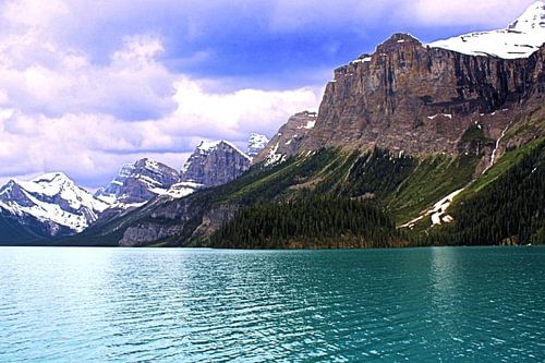 Mountain lake in Canada surrounded by Rocky Mountains