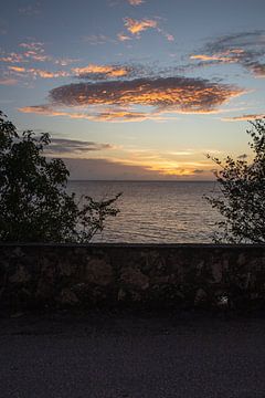 Zonsondergang op Bonaire van Bas de Glopper