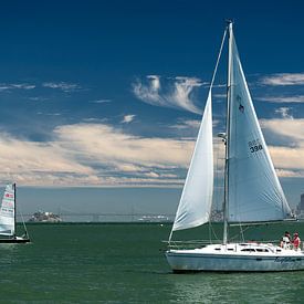 A couple of sailing ships navigate the San Francisco Bay (USA) by Carlos Charlez