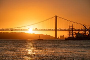 the port of Lisbon at sunset by Leo Schindzielorz