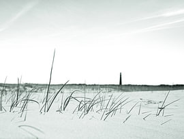 Plage avec phare, dans des tons doux