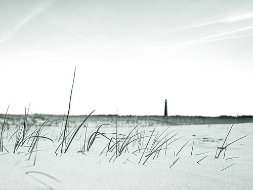 Strand mit Leuchtturm in sanften Farbtönen