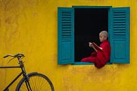 Reading a book in the window frame