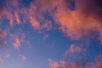 orange clouds against blue sky