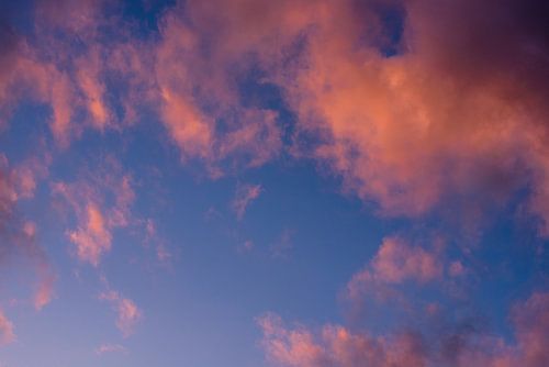 orange clouds against blue sky