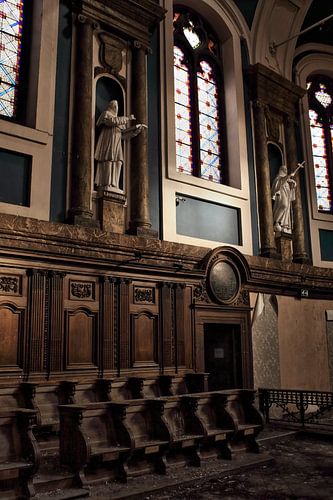 Urbex church with benches and stained glass windows
