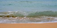Waves of the Ionian Sea wash ashore on the beach