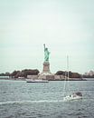Statue of Liberty is passed by sailboat by Mick van Hesteren thumbnail