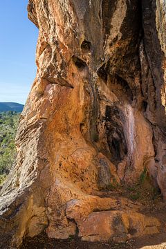 Coves Roges 2, red-brown rocks and caves by Adriana Mueller