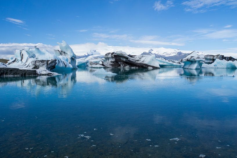 Iceland - Giant ice floes on joekulsarlon glacier lagoon with blue sky by adventure-photos