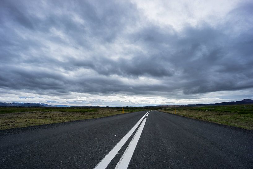 Iceland - Endless street through mountainous landscape and green meadows by adventure-photos