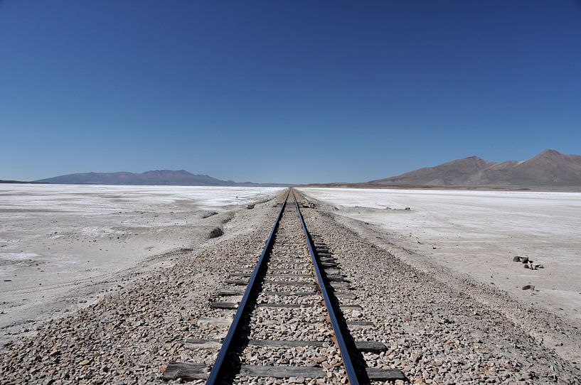 Rails in the White Desert: A Surreal View of the Salar d&#039;Uyuni by Frank Photos