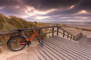 Orange bike at Stairs to South Beach The Hague near Kijkduin by Rob Kints