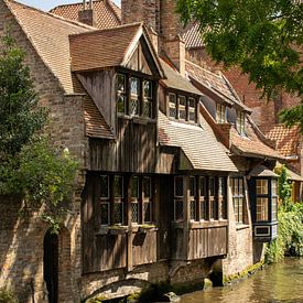 idyllic houses on the waterfront in Bruges during a beautiful summer day by Aan Kant