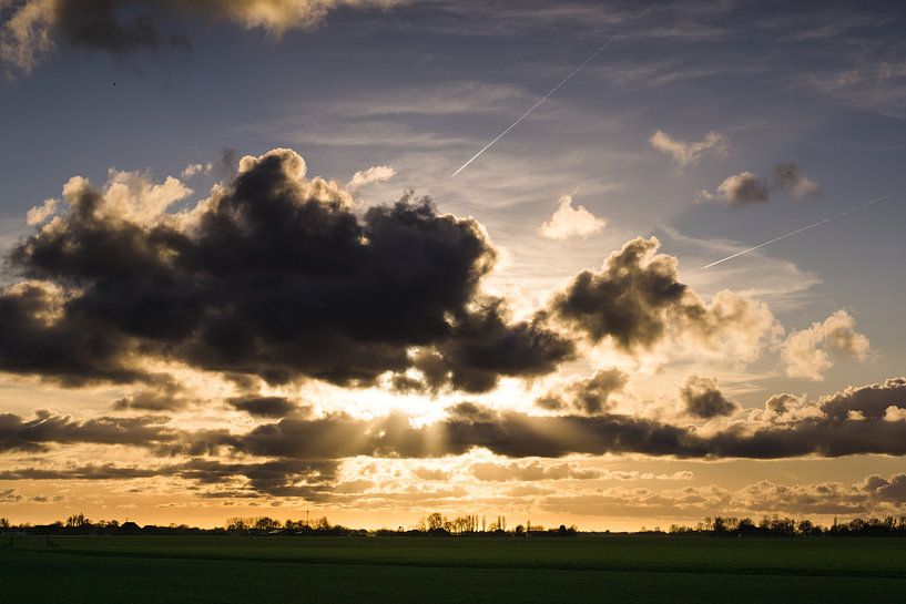 Sunset peeking through the clouds by Jasper van de Gronde