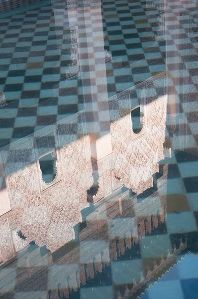 Reflection in water at Madrassa Ben Youssef by Margot van den Berg